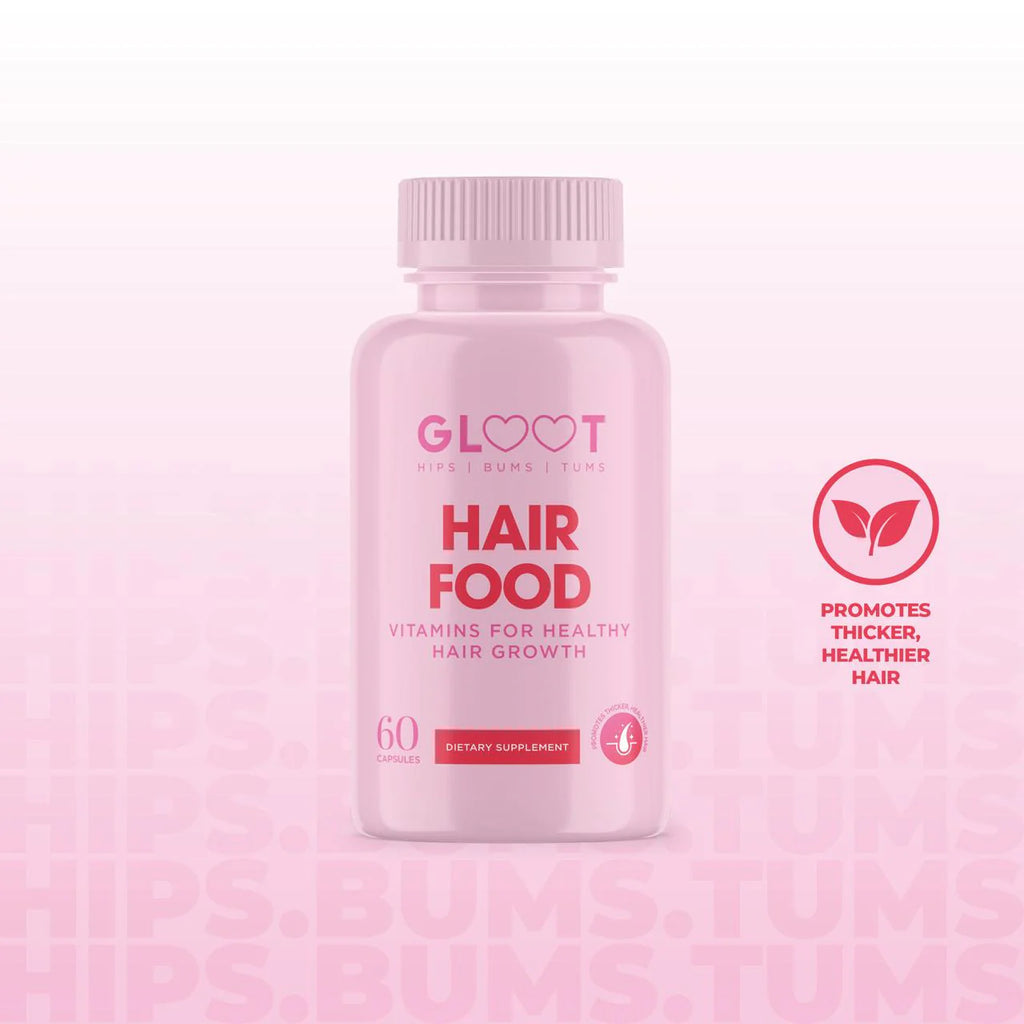 Pink bottle of 'Hair Food' supplements with 'GLOHEART' branding on a pink background Muscle Mecca