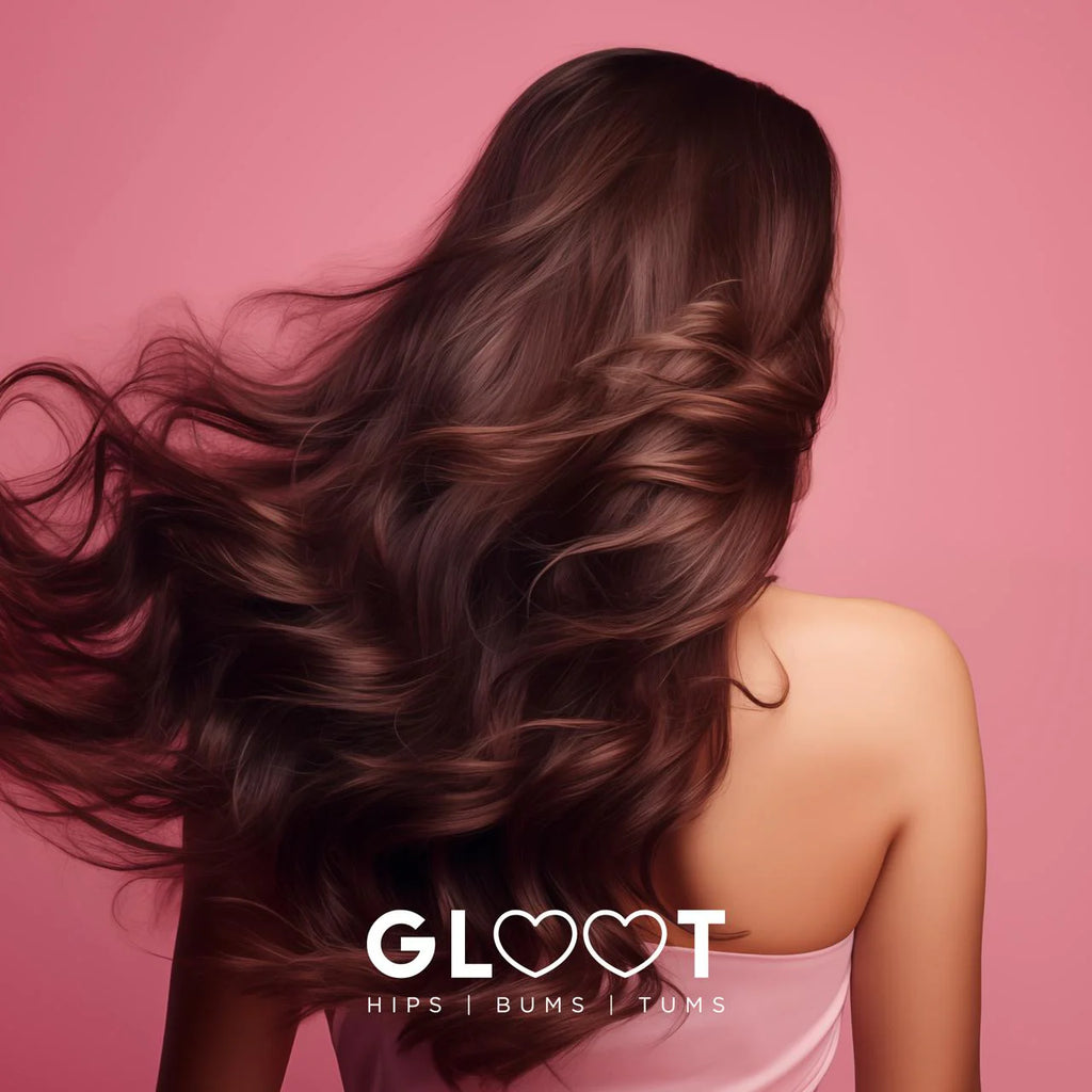 Woman with long, wavy hair against a pink background with 'GLOIT' branding. Muscle Mecca