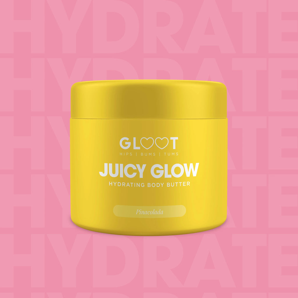 Yellow jar of 'Juicy Glow' hydrating body butter with 'GLOOT' branding on a pink background. Muscle Mecca