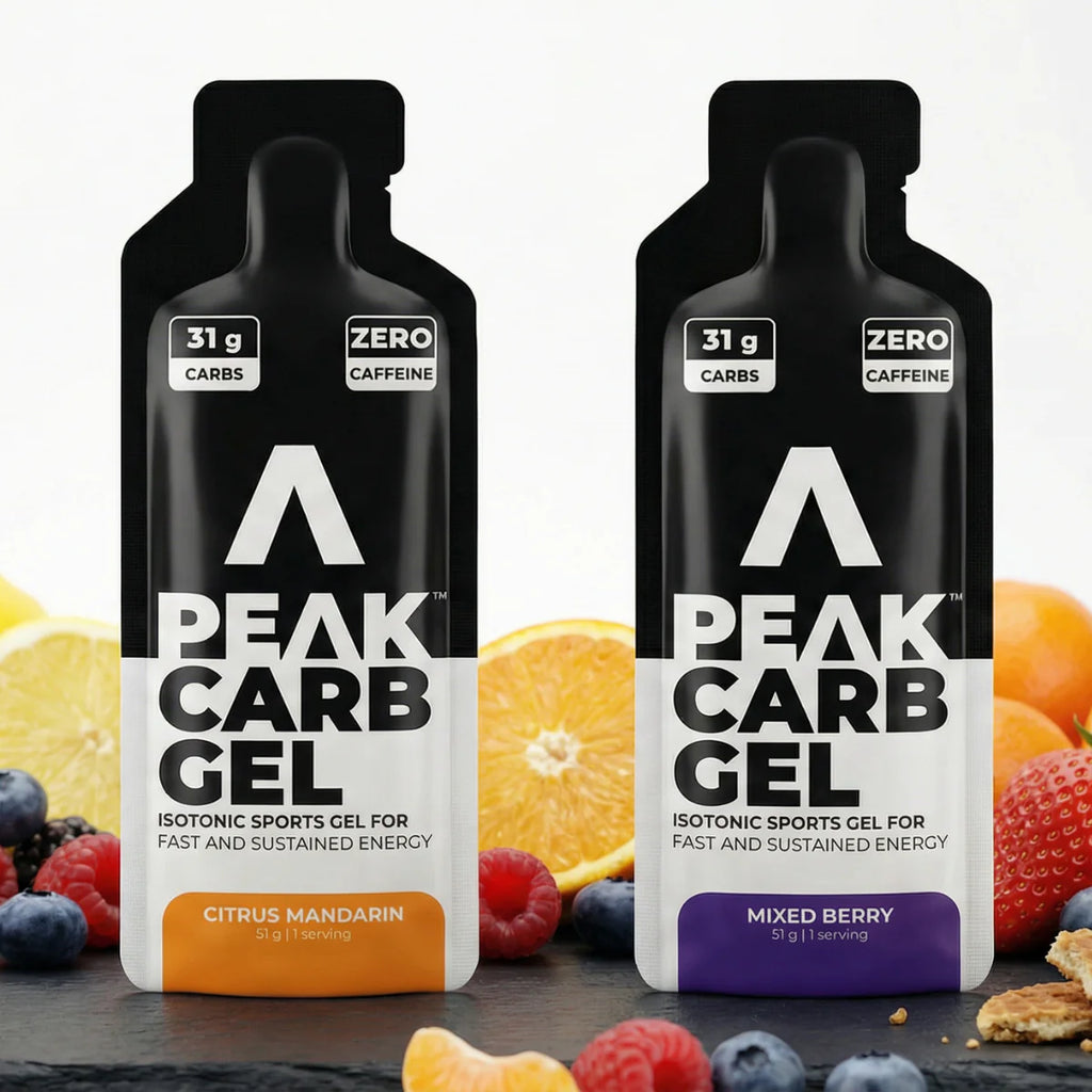Two Peak Carb Gel packages with fruit and snack elements on a white background Muscle Mecca
