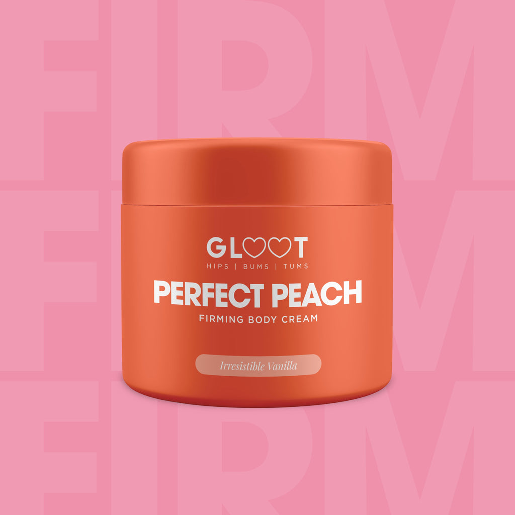 Orange jar of 'Perfect Peach' firming body cream with 'Gloot' branding on a pink background. Muscle Mecca