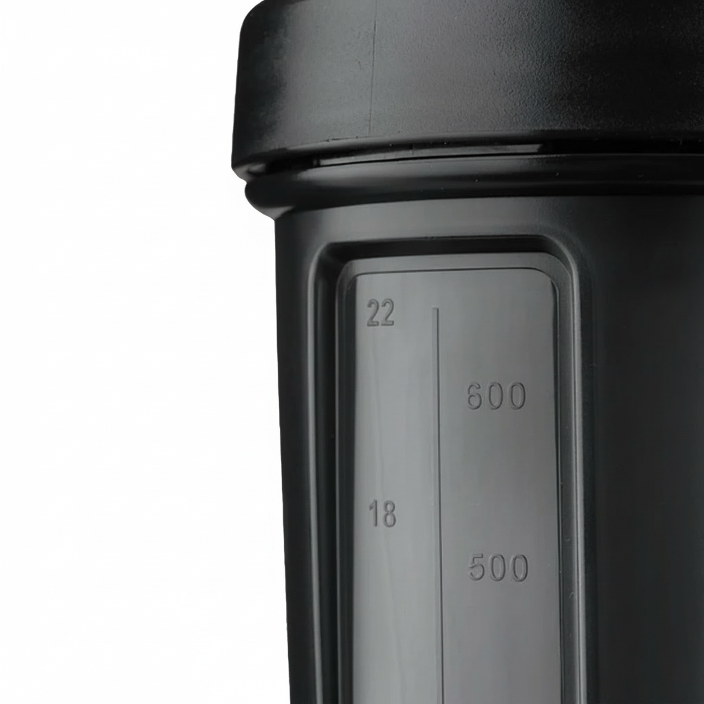 Black shaker bottle container with measurement markings on a white background Muscle Mecca